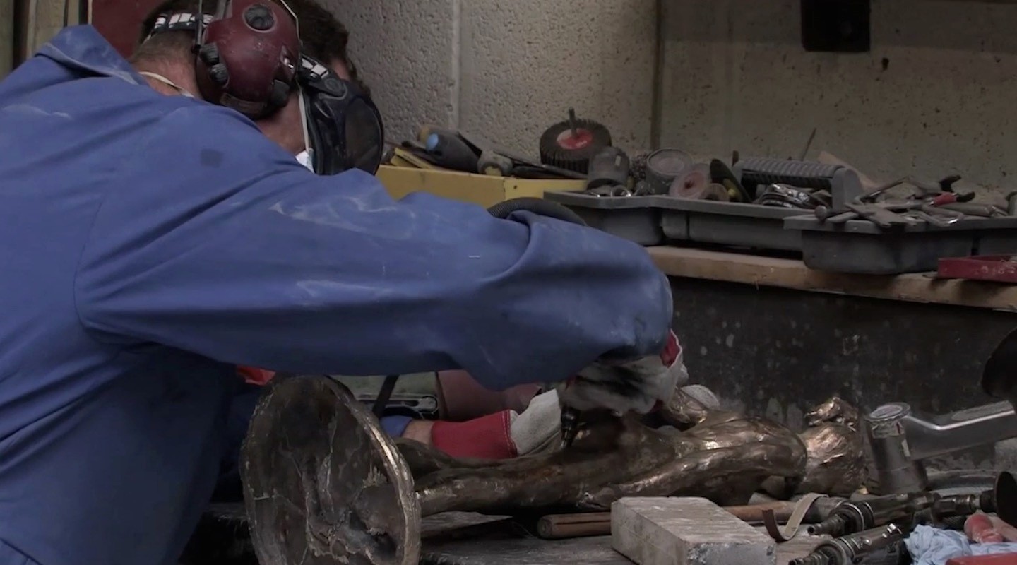 Craftsperson chasing and finishing bronze